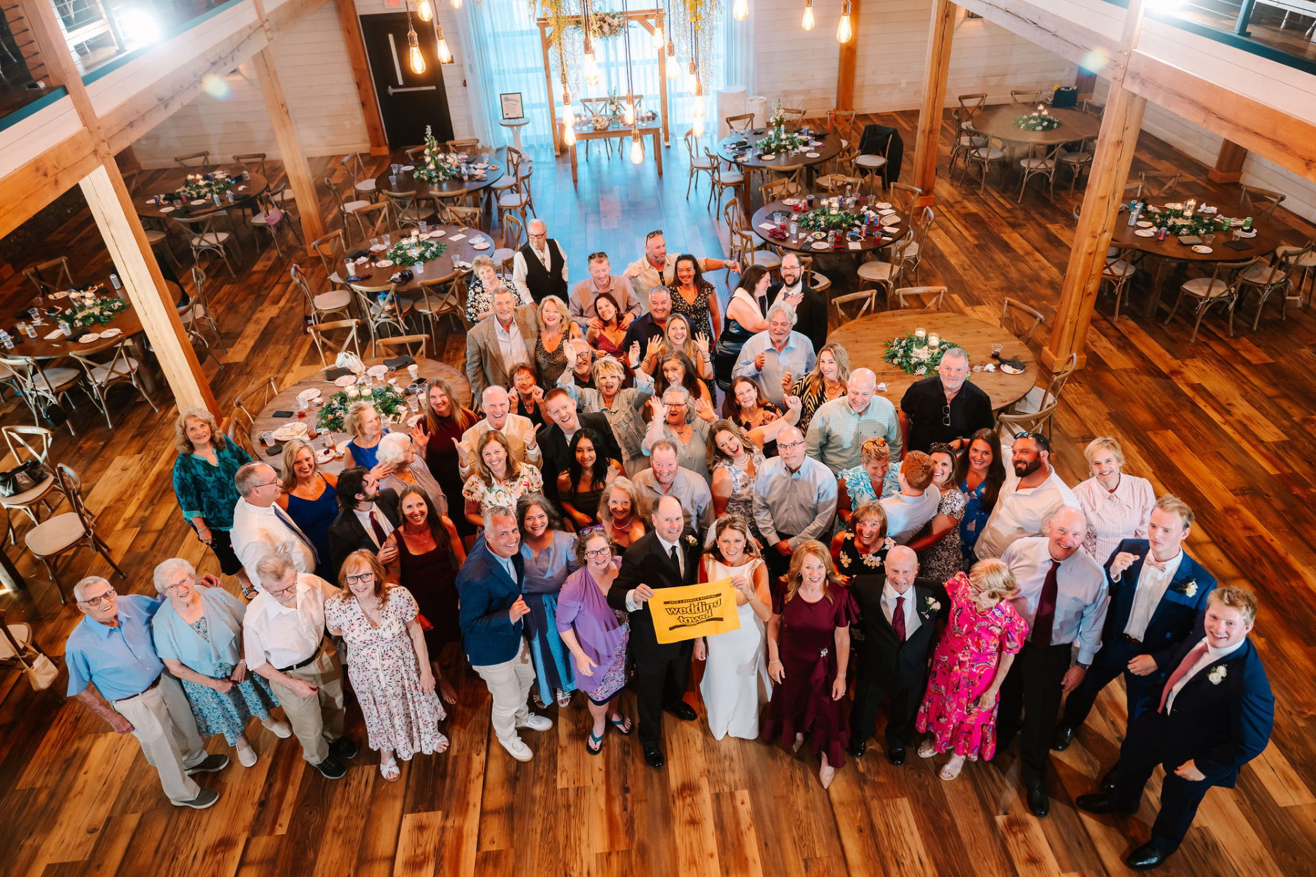 Greg, Sonnie, and all of their guests photographed from above inside the reception hall