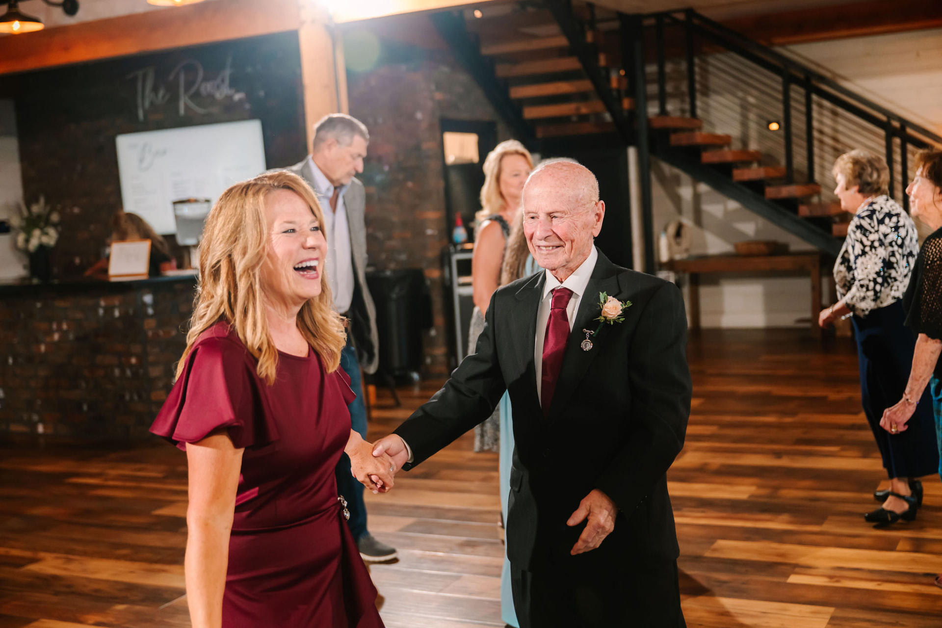 Guests laughing together on the dance floor