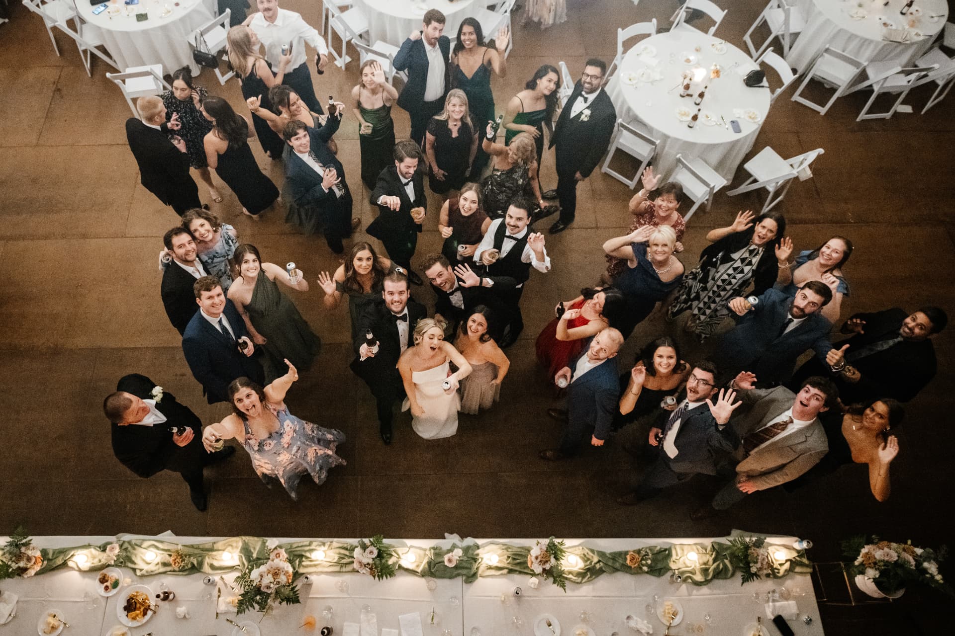An overhead photo of Sydney and Duncan with their guests